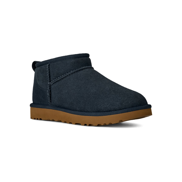 Navy ugg slipper with a tan midsole