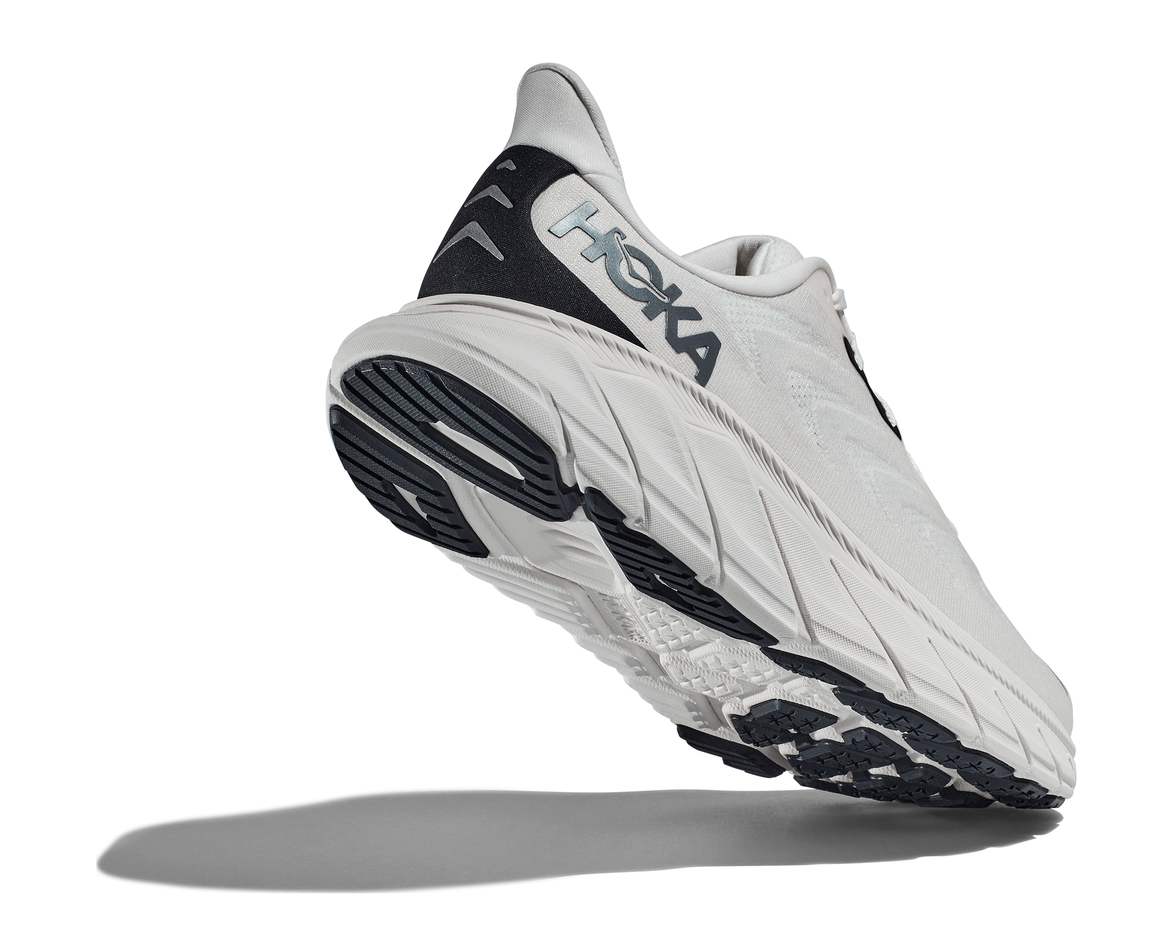 Back angled view of the Men's Arahi 6 by HOKA in the color Blanc de Blanc/Steel Wool