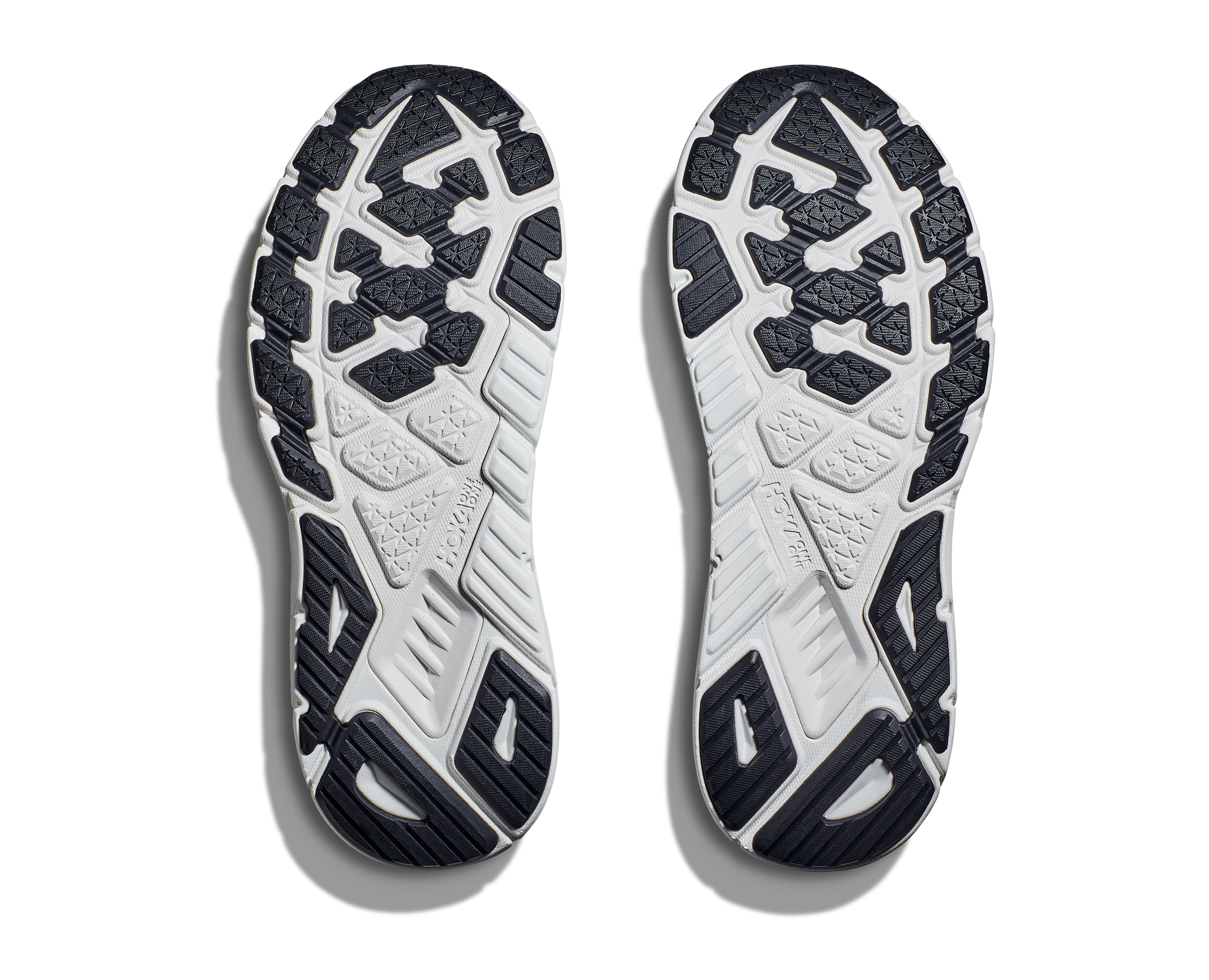 Bottom (outer sole) view of the Men's Arahi 6 by HOKA in the color Blanc de Blanc/Steel Wool