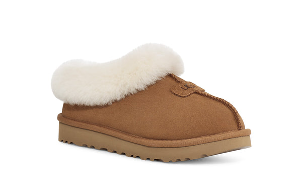 Sherling and tan slipper on a white background