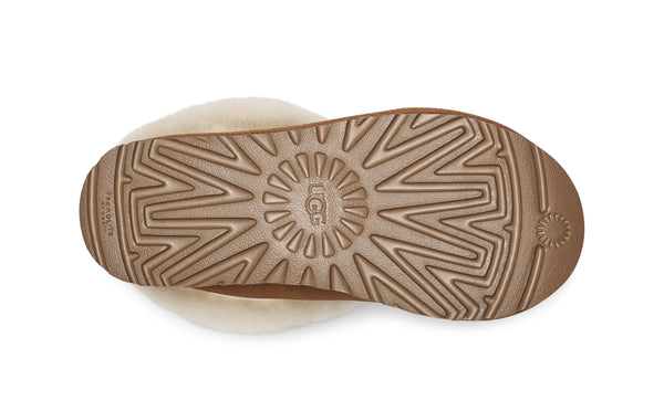 Sherling and tan slipper on a white background