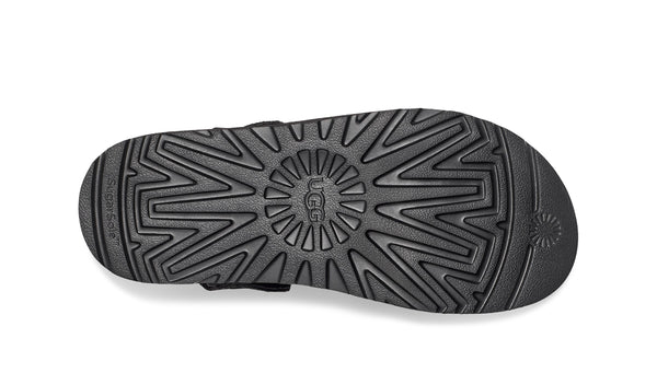 Black sling back clog on a white background