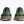 Green sneakers with textured design on a white background