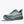 Gray and black sneaker with mountain design on a white background