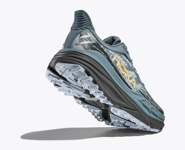 Gray running shoe with visible Hoka branding on a white background