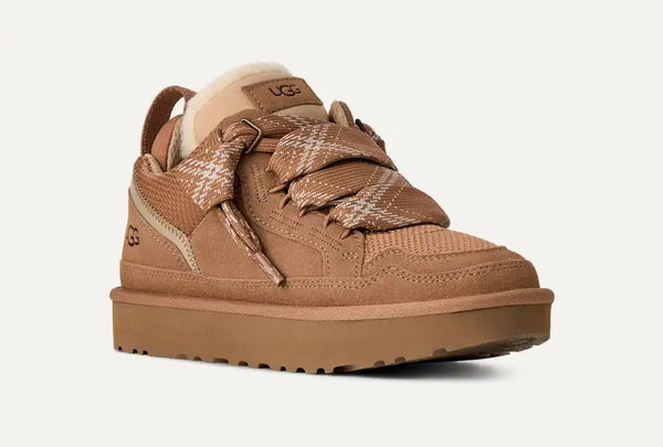 Tan sneaker with sherpa lining on a white background