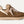 Tan and brown sneaker on a white background