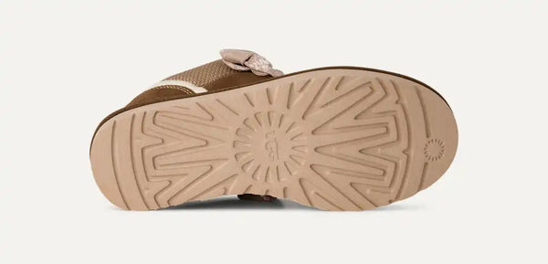 Tan and brown sneaker on a white background