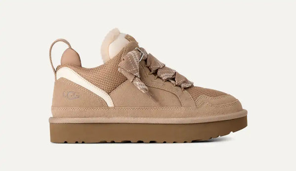 Light tan sneakers on a white background