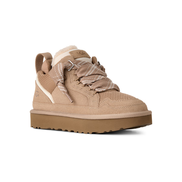 Light tan sneakers on a white background