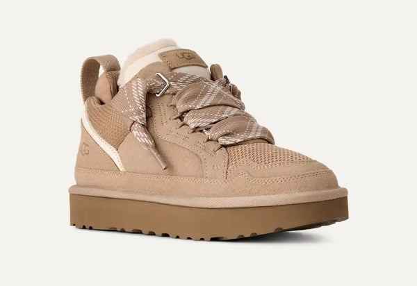 Light tan sneakers on a white background