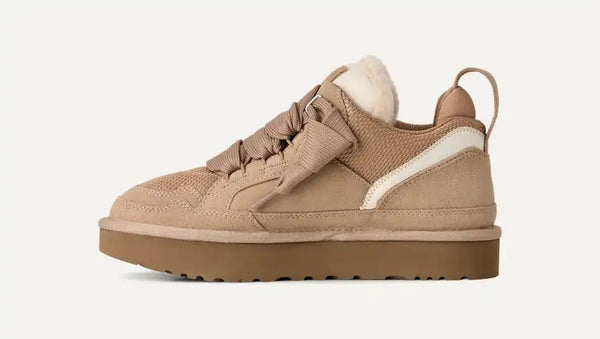 Light tan sneakers on a white background