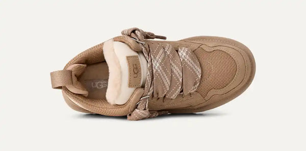 Light tan sneakers on a white background