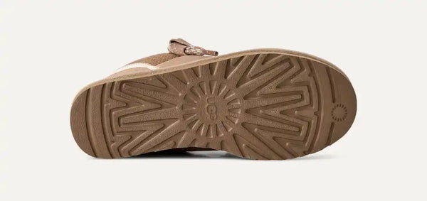 Light tan sneakers on a white background