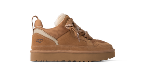 Kids tan sneaker on a white background
