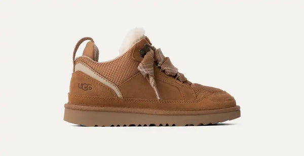 Kids tan sneaker on a white background