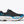 Black and blue running shoe with 'Hoka' branding on a white background