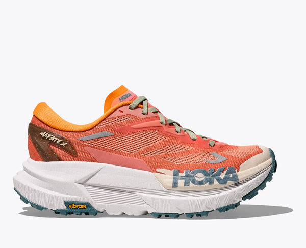 Orange and white Hoka trail running shoe with Hoka branding on a white background