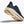 Navy running shoe with beige sole on a white background