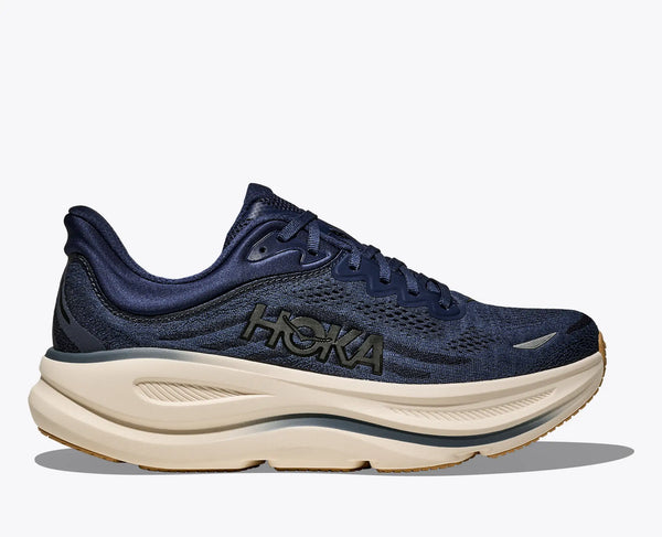 Navy Hoka running and walking shoe with beige sole on a white background