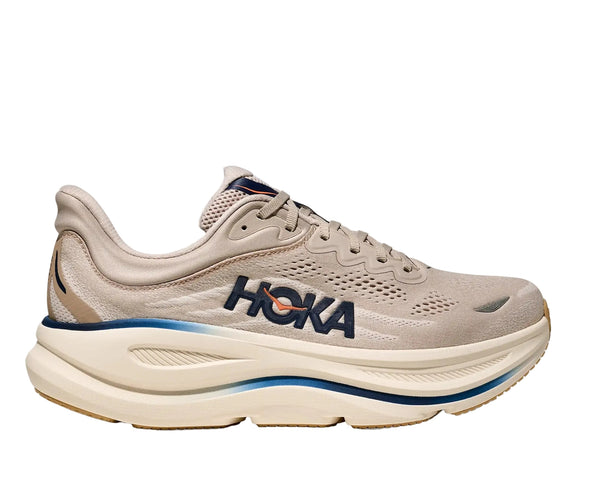 Beige running shoe with 'Hoka' branding on a white background
