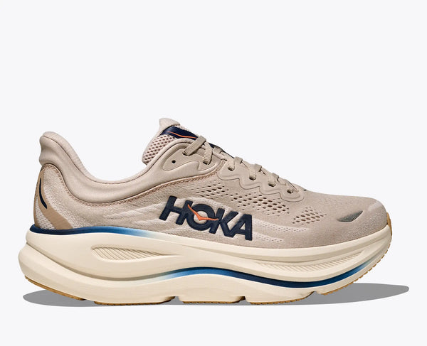 Beige running shoe with 'Hoka' branding on a white background