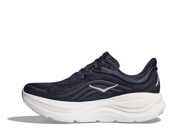 The Hoka logo is stitched into the middle of the medial side of the upper using grey thread. 