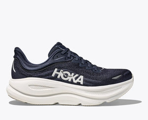 Navy running shoe with white sole on a white background