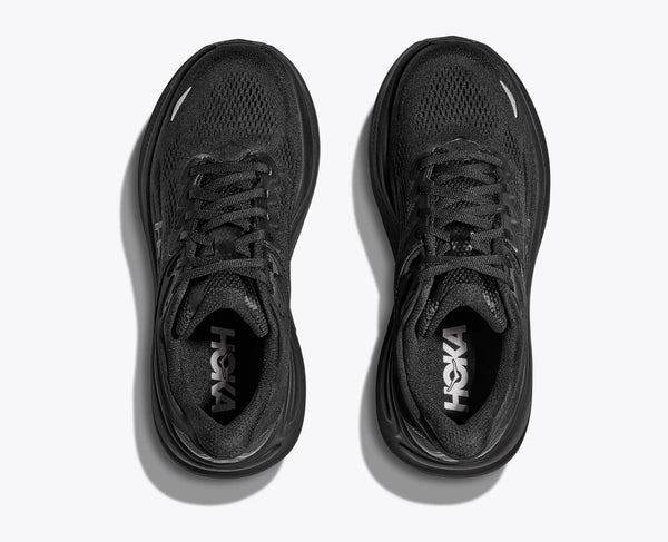 Top down look at a black running shoes with 'Hoka' branding on a white background