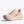 The medial side of a light pink running shoe on a white background