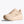 Beige running shoe on a white background