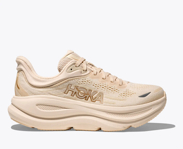 Beige running shoe with 'Hoka' branding on a white background