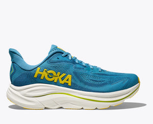 A look at the lateral side of a blue Clifton 10 that has a neon Hoka logo in the middle of the shoe.