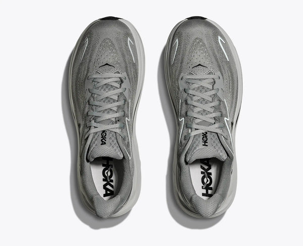 Gray running shoes with 'Hoka' branding on a white background