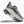 A closeup of a Clifton 10 with a grey upper and white midsole.