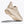 Beige sneaker with brand logo on a white background with a view of most of the outsole