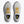 White running shoes with yellow laces that look like a boot and visible branding on a white background.