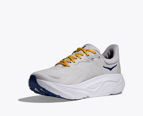 White Hoka Arahi 8 running shoe with yellow laces on a white background.