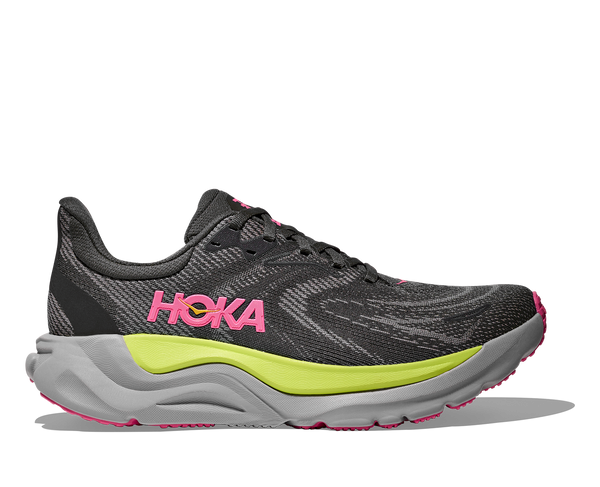 Black, neon green, neon pink, and grey running shoe on a white background