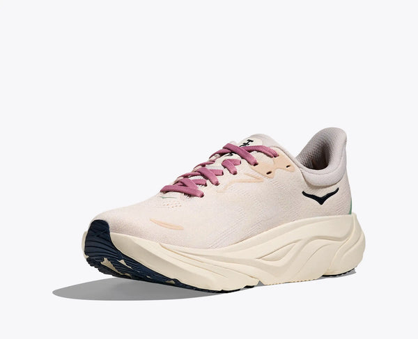 White running shoe with pink laces on a white background