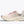 White running shoe with pink laces on a white background