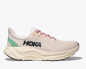 Cream colored Women's hoka running shoe on a light grey background