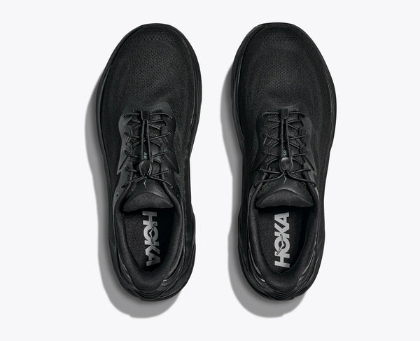 Black Hoka running shoes on a white background