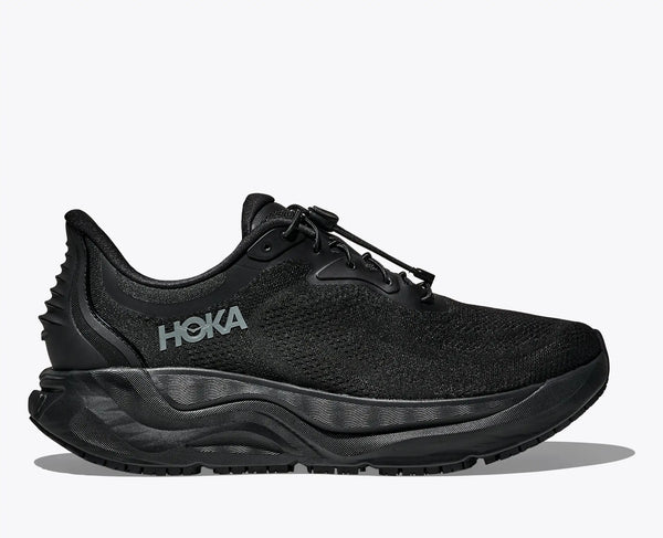 Black slip-resistant walking adn running shoe with silver accents on a white background.