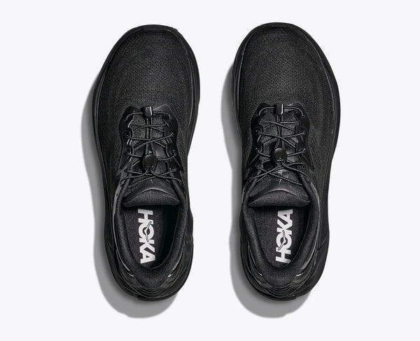 Black Hoka running shoes on a white background