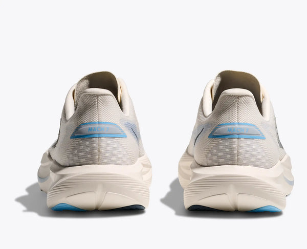 Alabaster colored fast running shoes with blue accents on a white background and teh model name written on the heel.