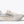 White running shoe with blue accents on a white background