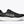 Black running shoe with white sole on a white background