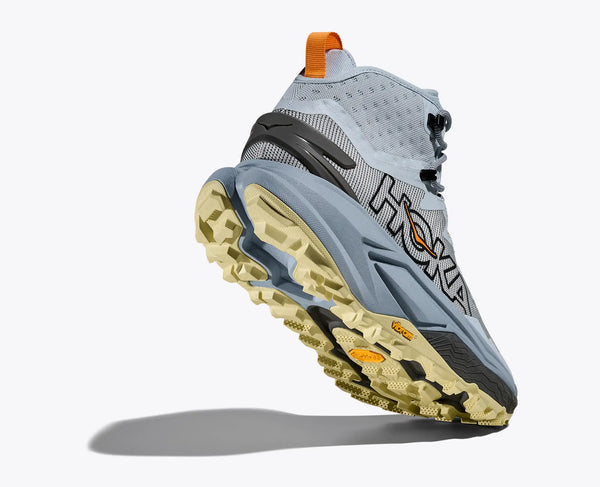 Hoka running shoe with a gray and orange design on a white background