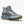 Gray hiking boot with orange accents on a white background